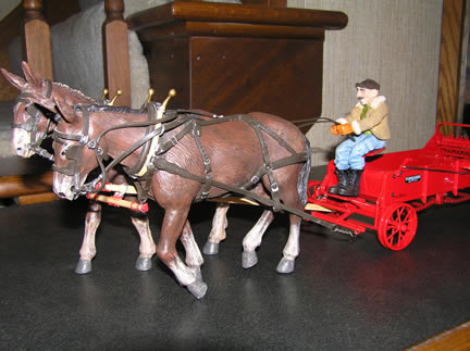 4253CO Precision McCormick 200H Spreader with Mules - Horse Drawn Heritage