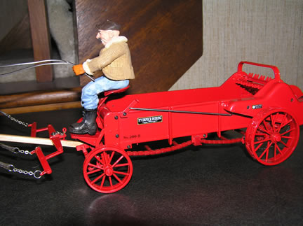 4253CO Precision McCormick 200H Spreader with Mules - Horse Drawn Heritage